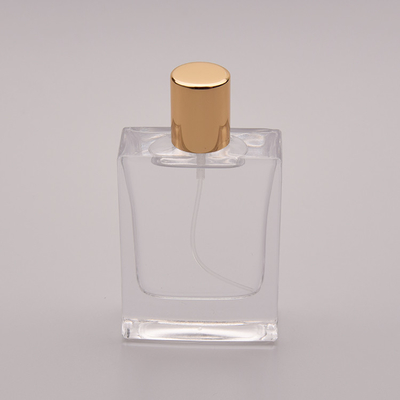 بطری عطر شیشه ای تخت 50 میلی لیتری با درپوش طلایی کوچک